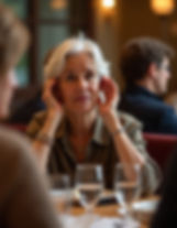 freepik__older-woman-cupping-ear-to-hear-better-at-a-restau__10713.jpeg