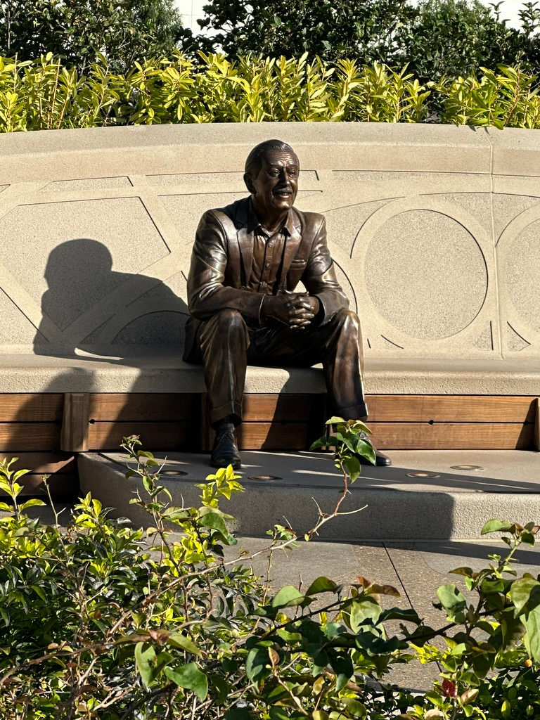 Bench with a statue of Walt Disney sitting