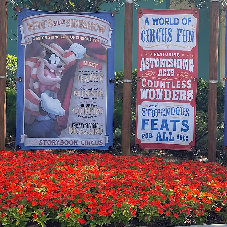 Pete’s Silly Sideshow sign at Magic Kingdom, with bold circus lettering and vintage artwork, inviting guests to meet costumed versions of classic Disney characters inside.