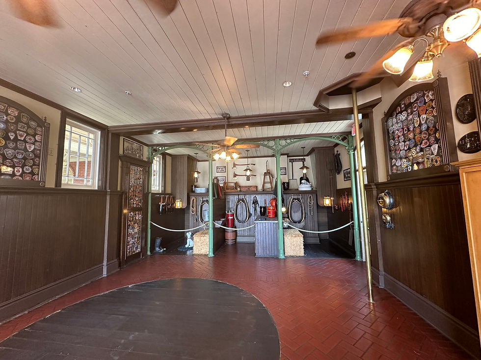 Inside the Main Street Firehouse at Magic Kingdom, showcasing vintage firefighting gear, and a tribute to the park’s connection with firehouse tradition.
