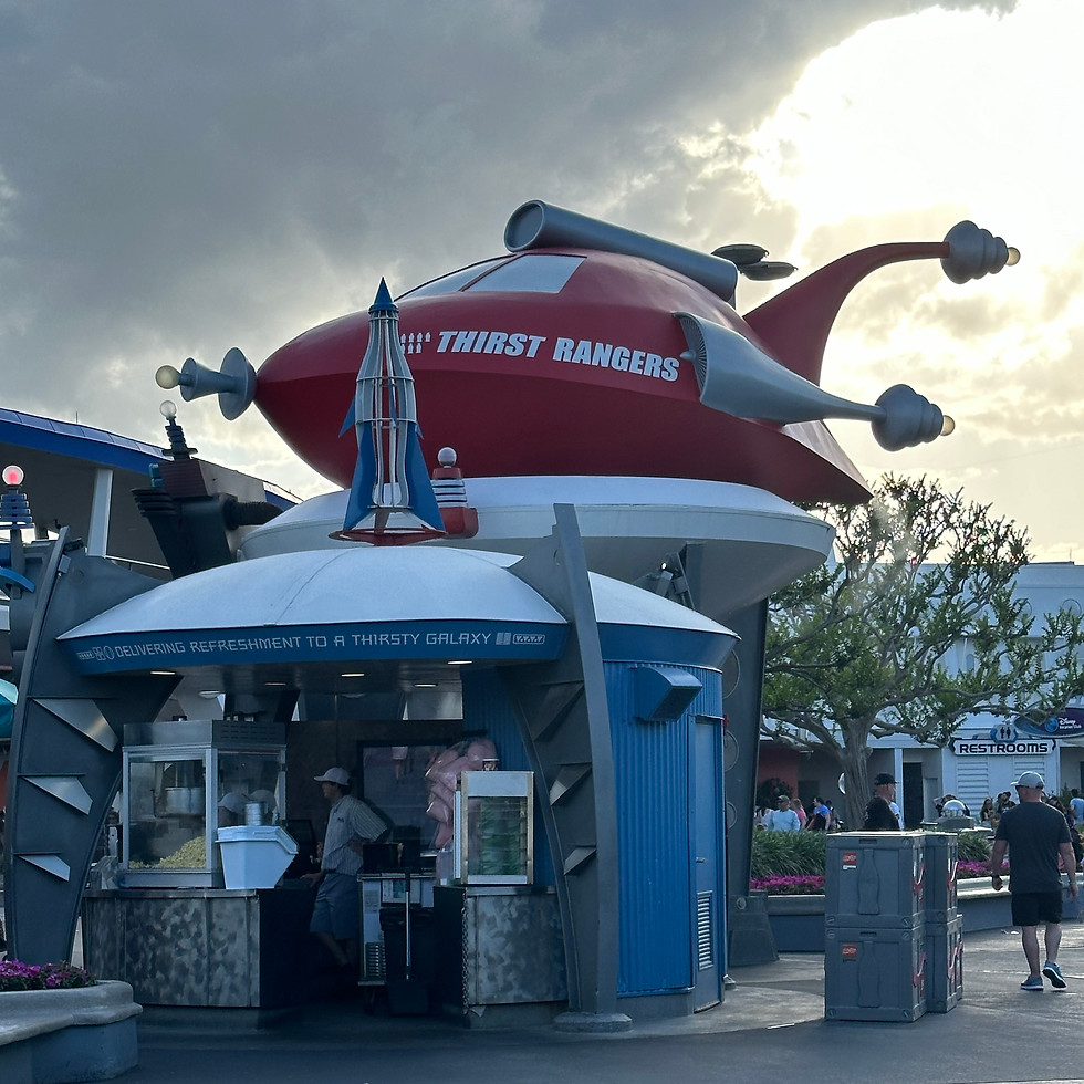 Cool Ship in Tomorrowland, a futuristic snack stand styled like a spaceship, complete with bright red paint and high-tech theming.