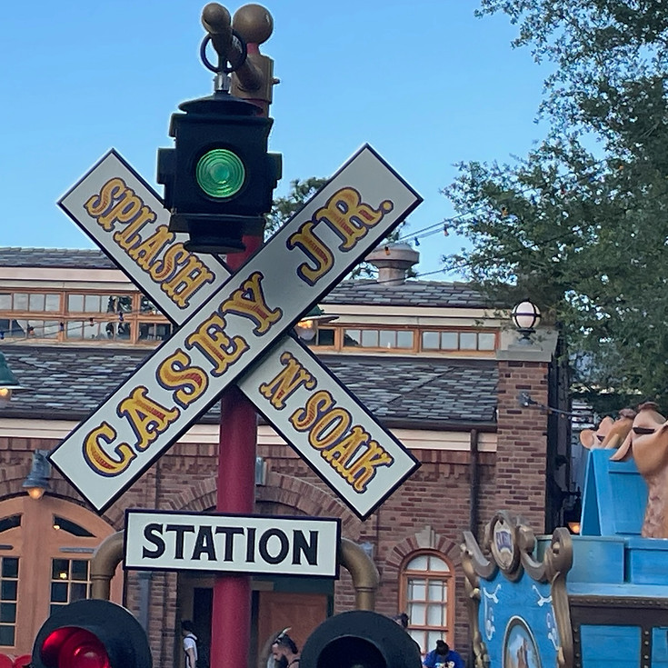 Casey Jr. Splash ‘N’ Soak Station at Magic Kingdom, with a railroad crossing colorful whimsical animal designs offering playful fun for kids.