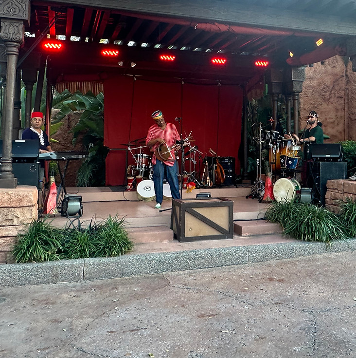 Atlas Fusion performing on stage with various instruments