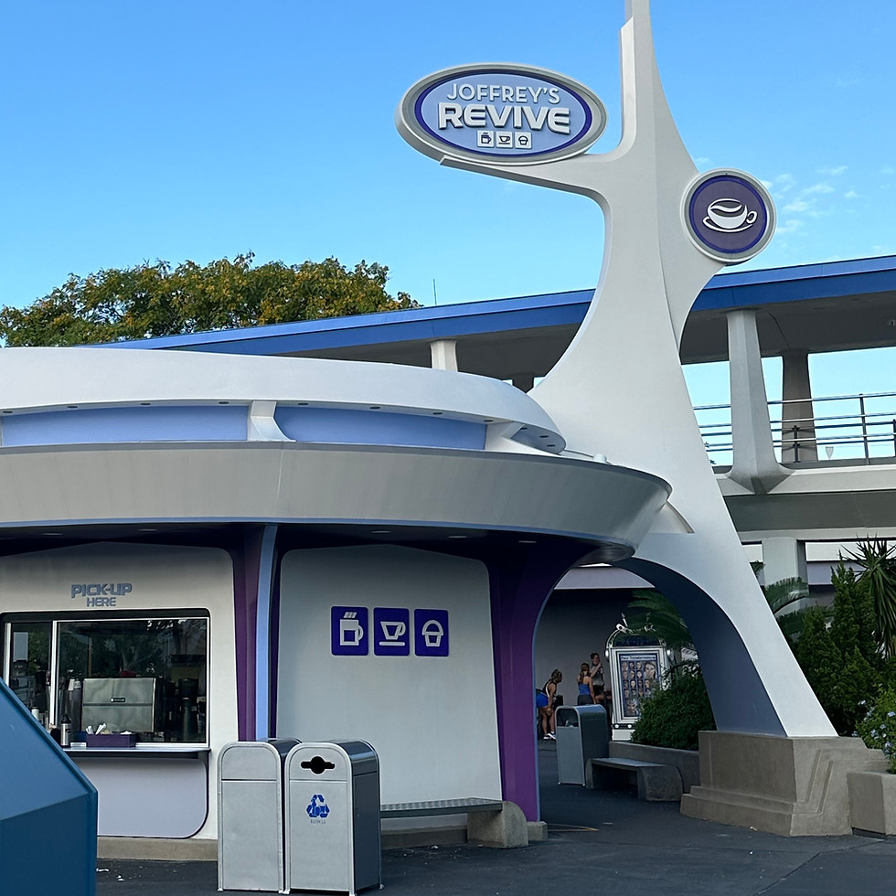 The Joffrey’s Coffee & Tea stand at Magic Kingdom, with its spaceage building and Joffrey's Revive signage inviting counter, serving fresh coffee, tea, and seasonal drinks.