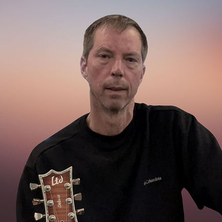 Man holding a guitar