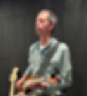 Man playing an electric guitar.