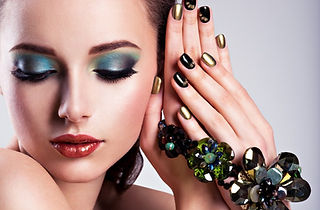 beautiful-woman-face-with-green-make-up-glass-jewelry-creative-nails-min.jpg