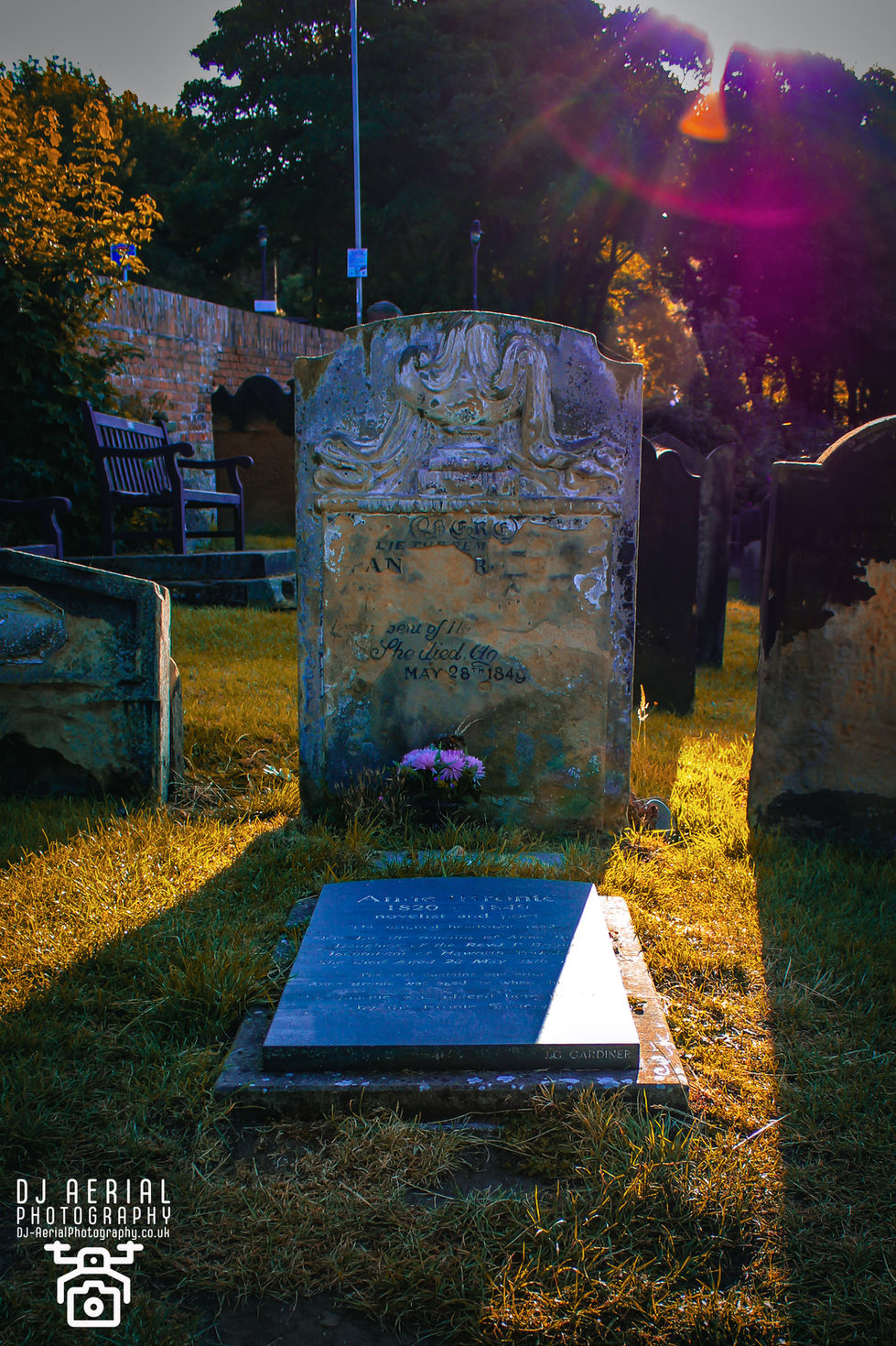 a gravestone in a cemetery with the date may 28 1845