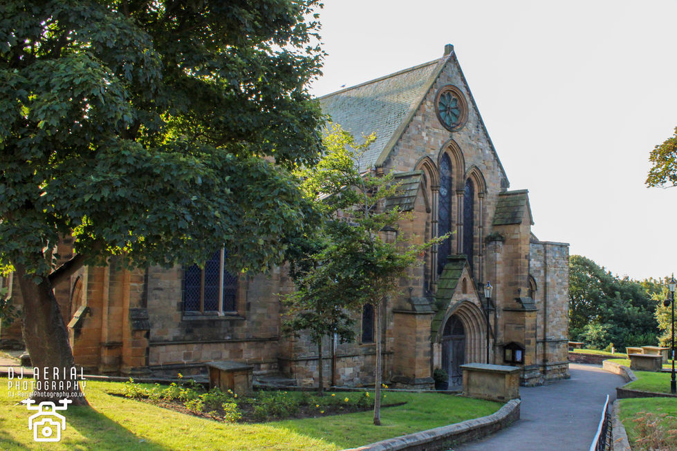 a church with a clock on the front of it