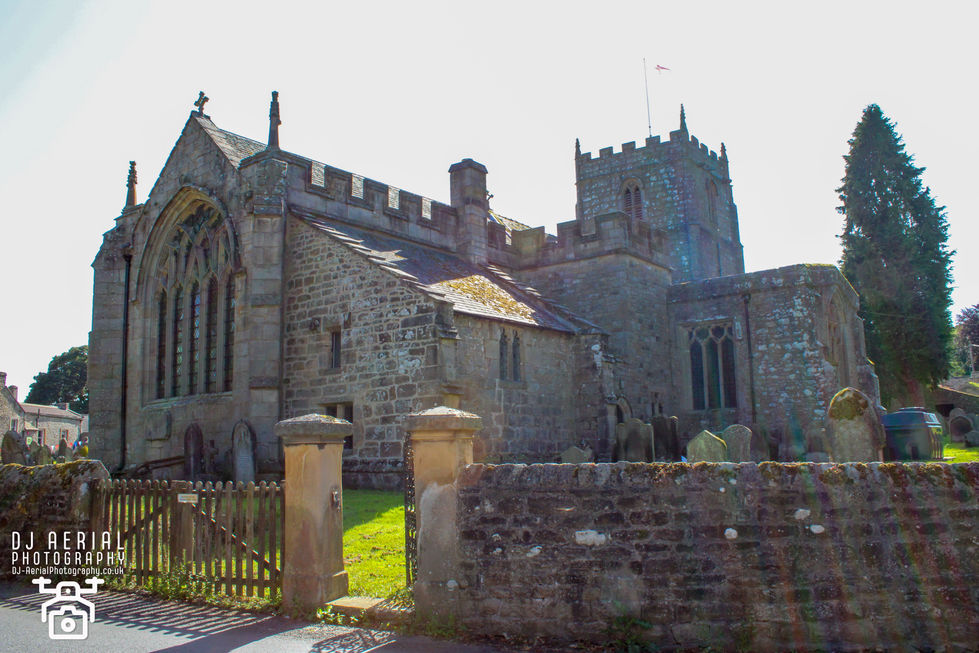 a large stone building with a flag on top of it