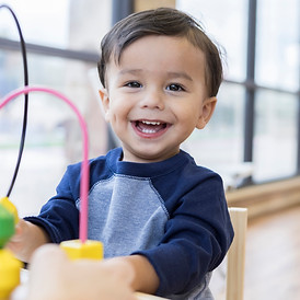 language therapy little boy playing with toys
