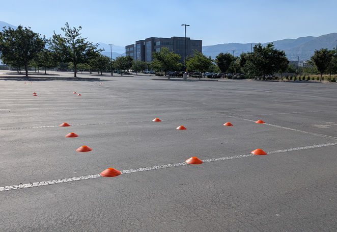 A series of cones in a parking lot