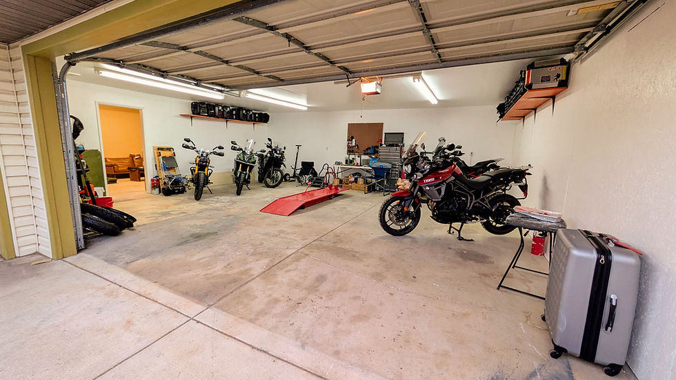 A garage filled with motorcycles and tools