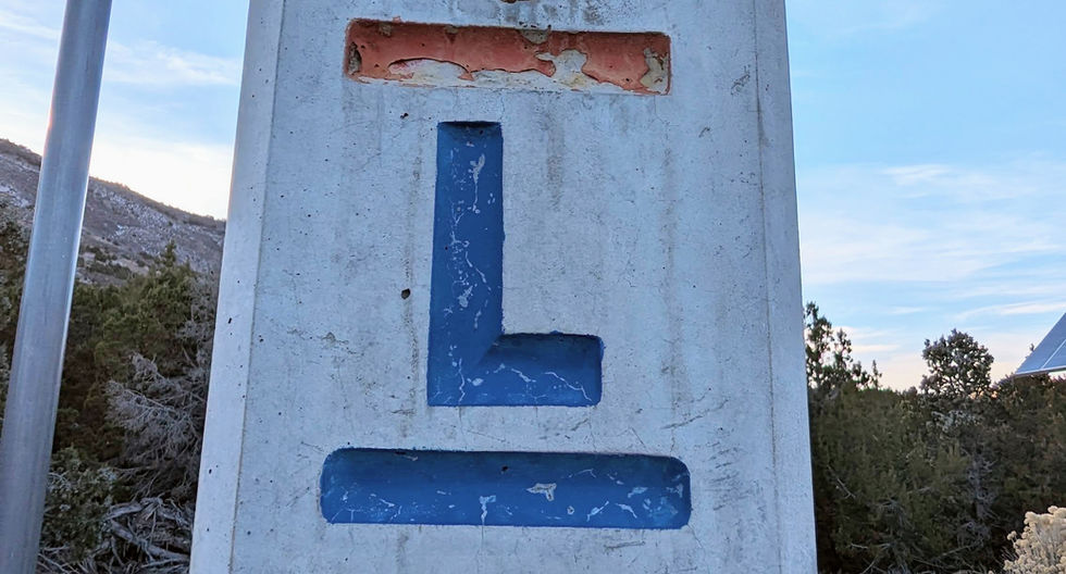 A stone historical sign