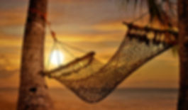 hammock on the beach at sunset