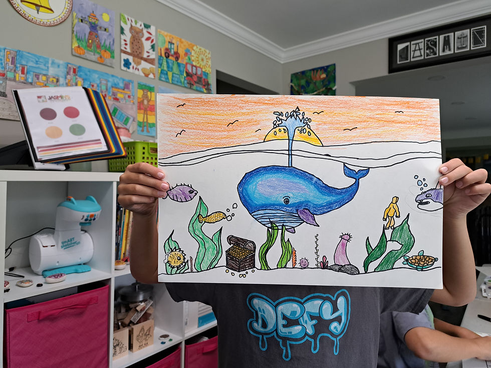 High angle view of a gift card and art supplies on a colorful table