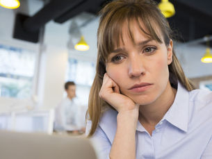 worried looking female with head in hand