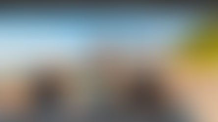 Couple in convertible drive along a coastal road, arms raised. Text: “Your rate now: 7.99%, Your new rate: 4.99%.” Mood: Joyful.