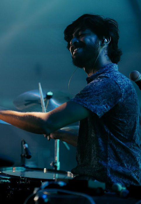Praran Gulvady of the Perfect Strangers performing live on stage