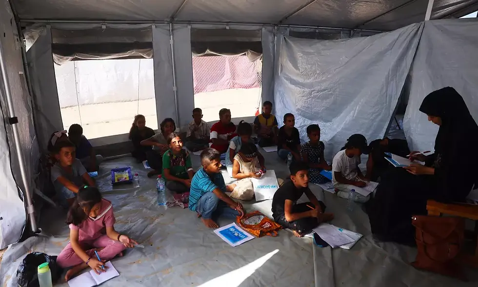 Children attending a lesson at one of UNICEF’s Temporary Learning Spaces in North Gaza - Image from UNICEF State of Palestine (2024, November 21)