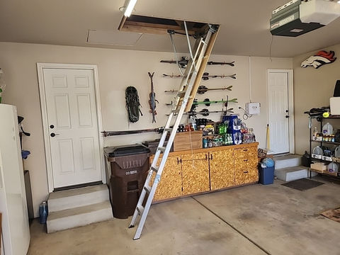 pull-down ladder installed in garage ceiling for attic access
