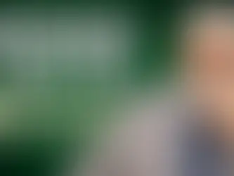 Dr. Shabir Ally in front of a green geometric backdrop discussing missed fasts and the rulings of fidya and kaffara.