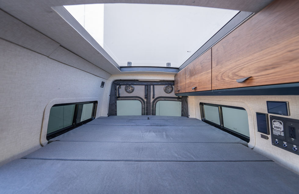 Skylight and Olympic Queen Bed Expanded in Sundance Kid 144 Pro-X Camper Van by Off Highway Van