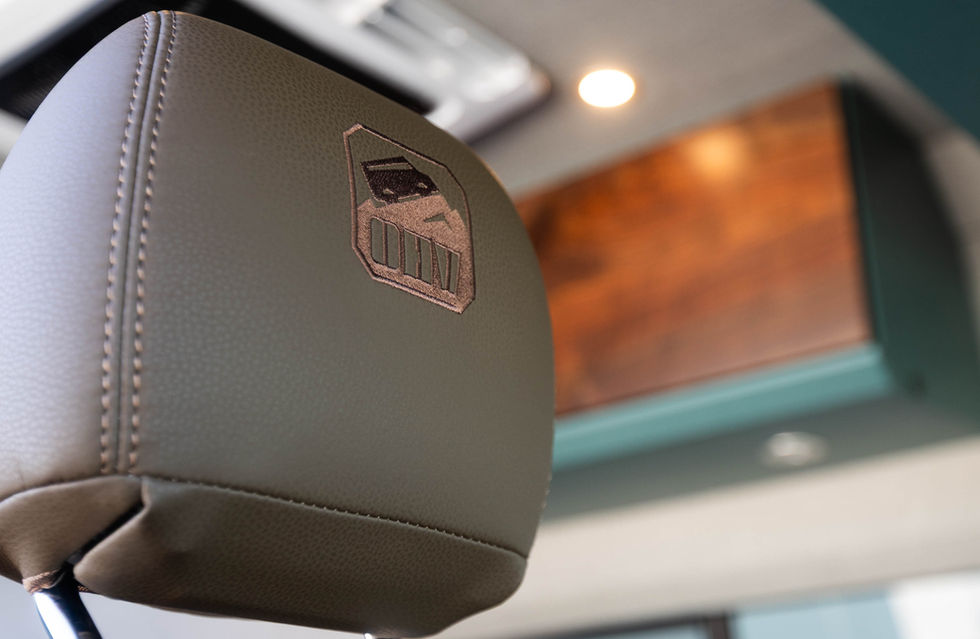 Custom Upholstered Seats in a 2026 Davey Jackson 144 Pro Luxury Off Grid Camper Van Interior Designed by Off Highway Van