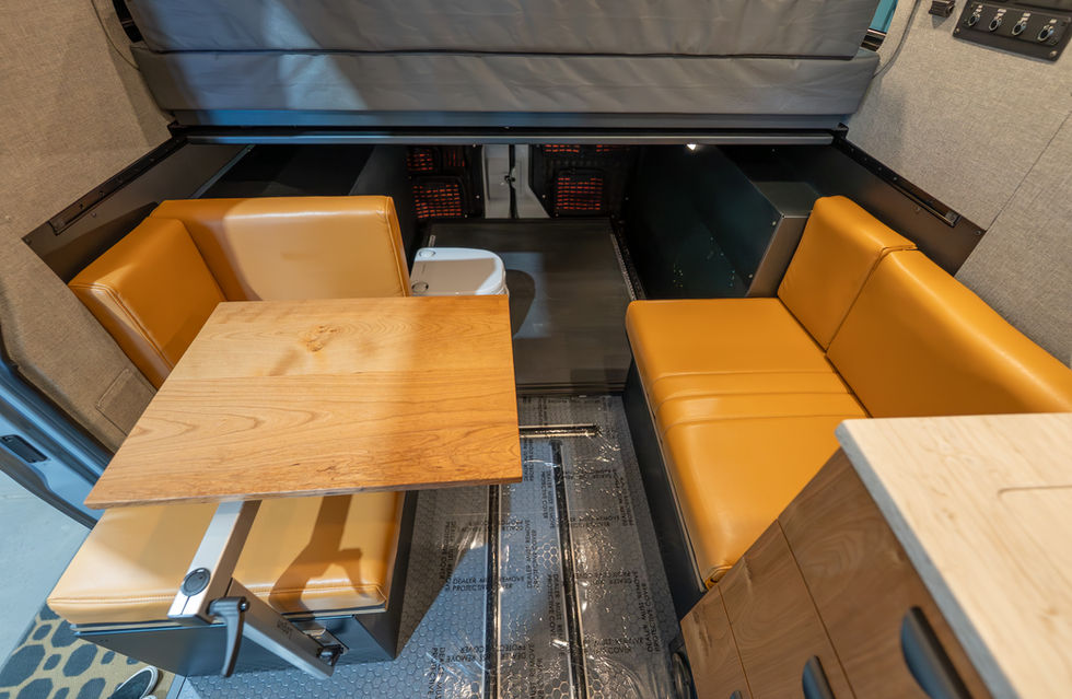Sundance Kid 144 Pro Off-Grid Offroad Adventure Camper Van Cafe Seating Area with Lagun Table