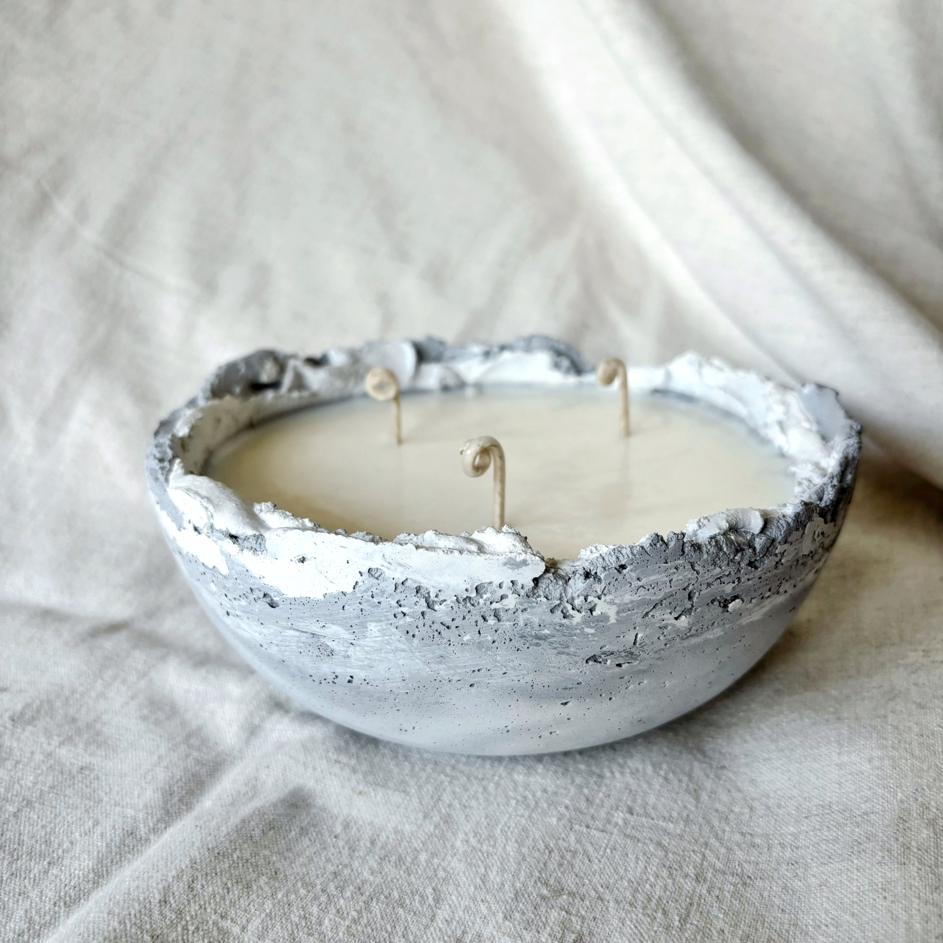 Luxury soy candle with White Amber & Musk fragrance in a handcrafted concrete vessel