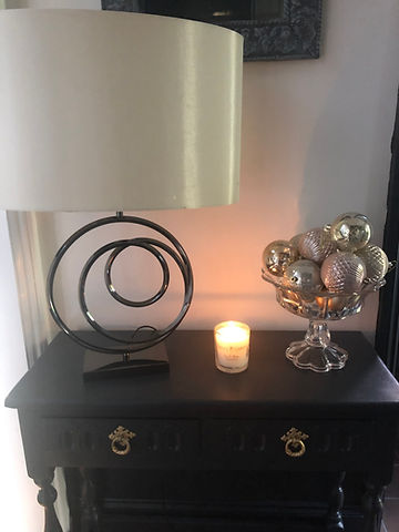 Sideboard with candle and lamp