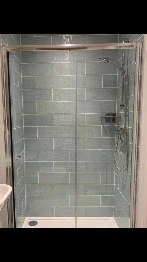 Grey tiled shower cubical