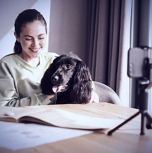 Happy young brunette woman studying onli