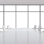 Empty white meeting room with white chairs, no people, symbol for strategy without substance