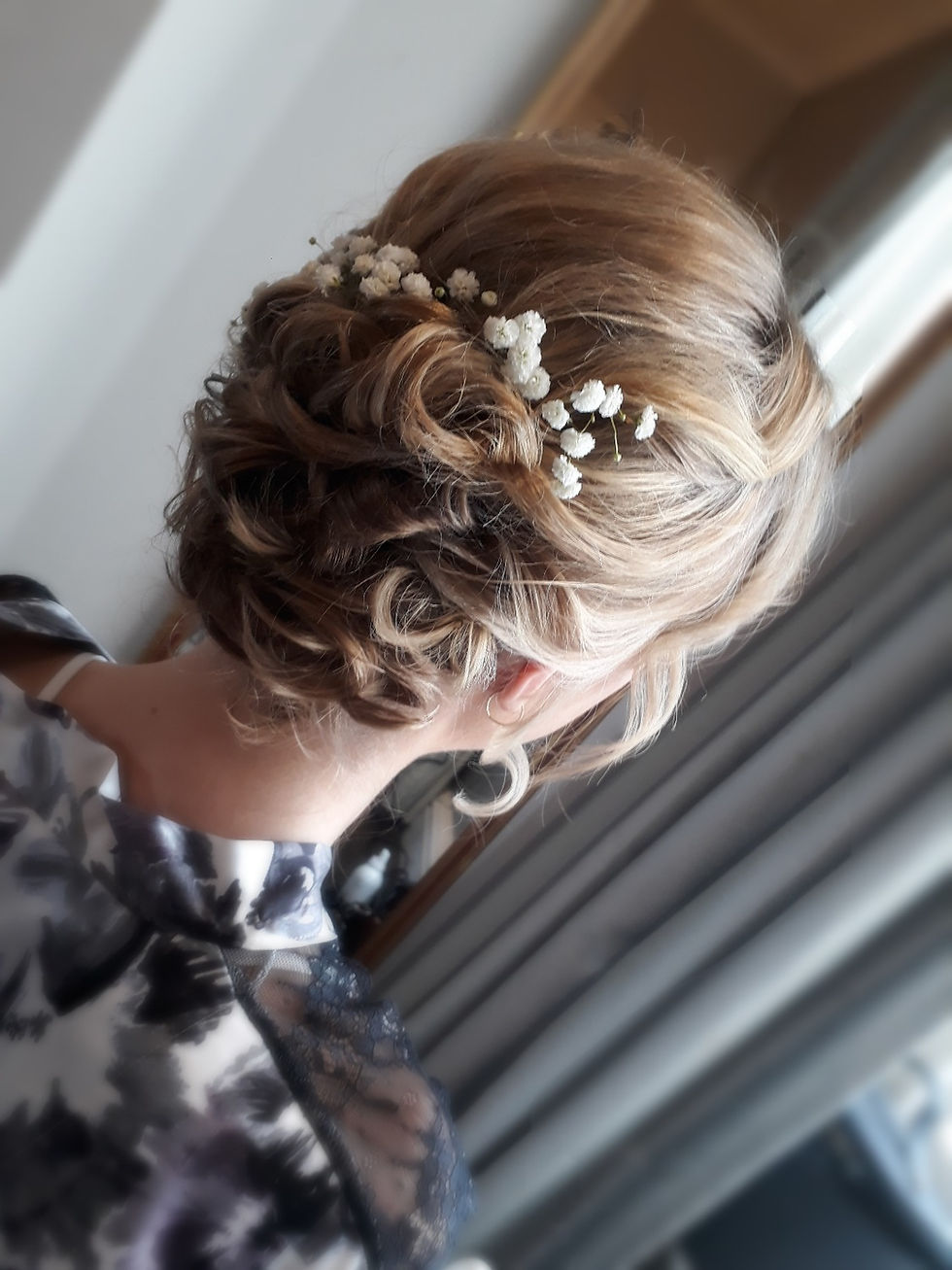 Classic bridal updo with fresh flowers, gypsophila