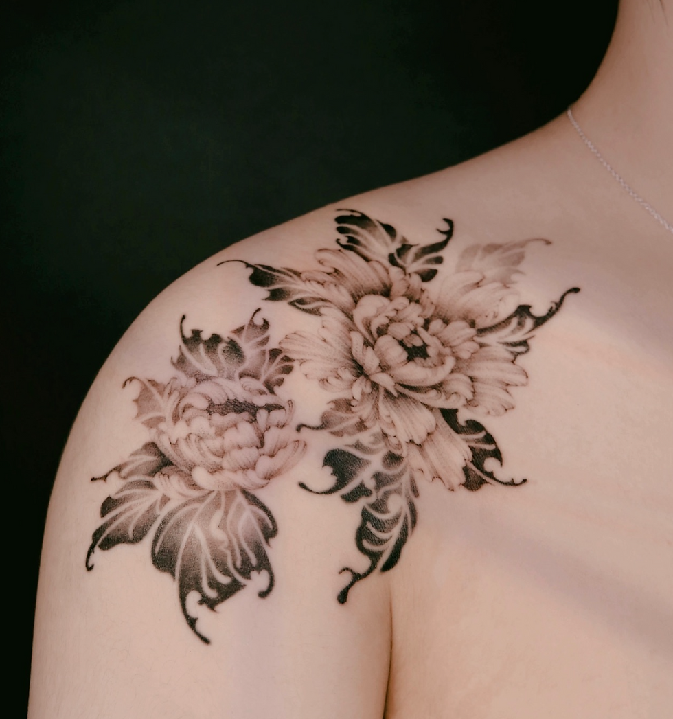Fine line flower tattoo