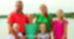 Carolyn Bosn stands outdoors beside her husband and their five children.