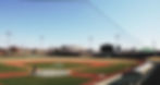 An empty baseball field overlooks the downtown Lincoln skyline.