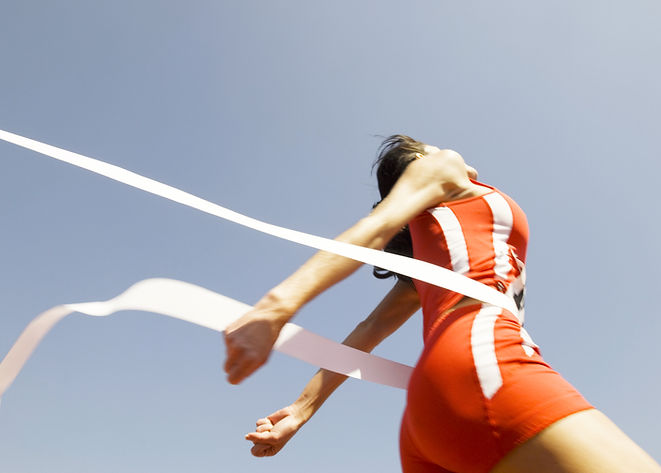 Woman Crossing Race Finish Line