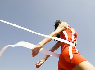 Woman Crossing Race Finish Line
