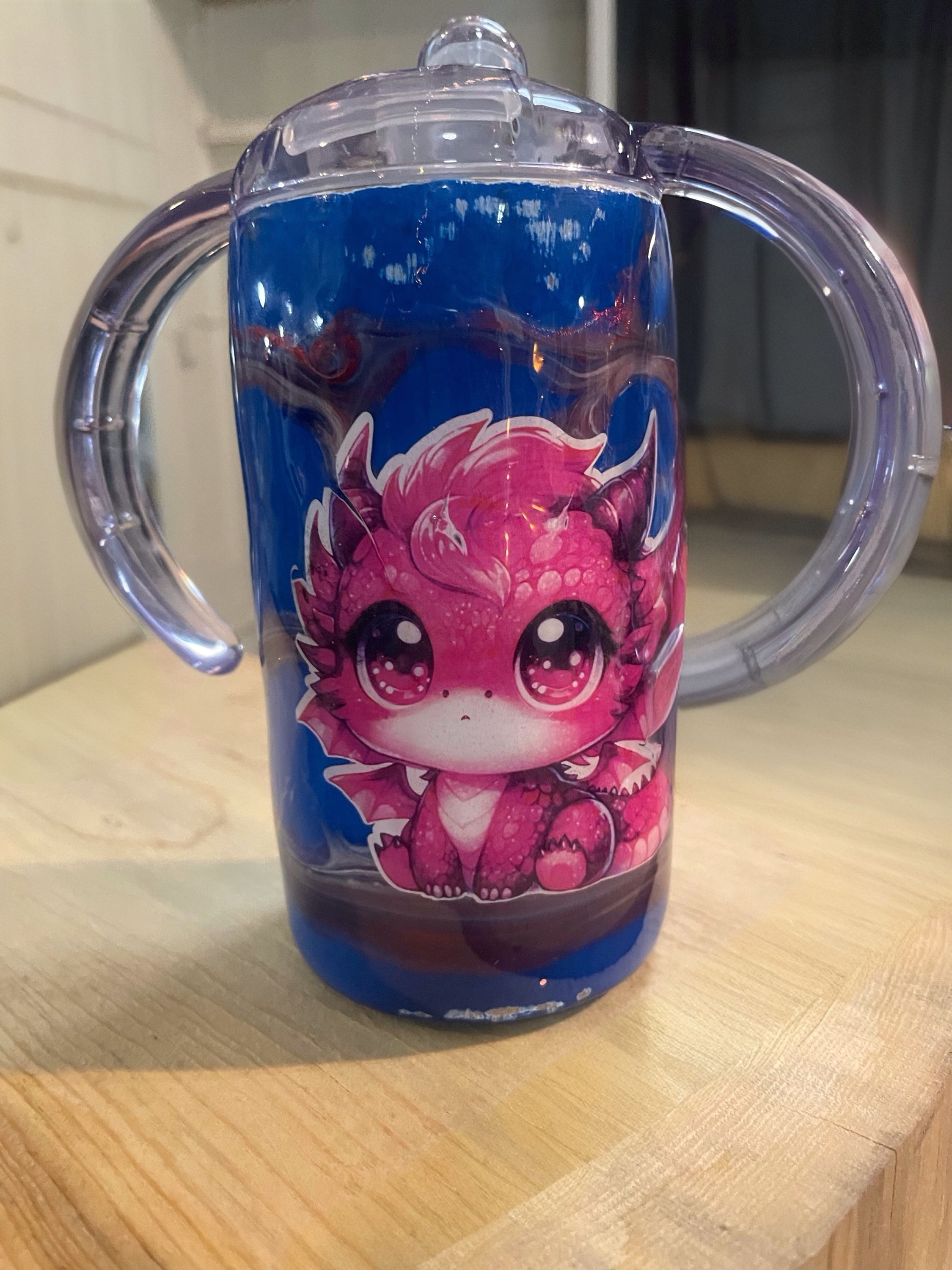 A vibrant red 12oz kids tumbler featuring a cool dragon design.