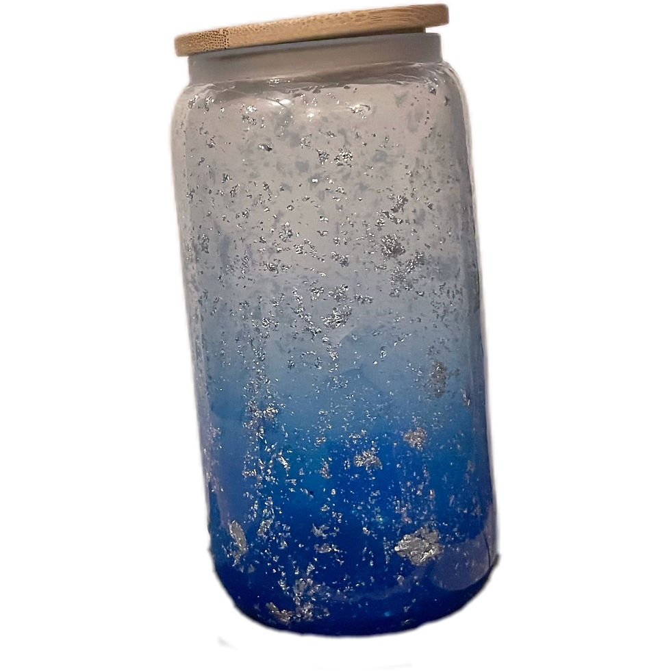  Close-up of an 18oz glass showcasing a gradient blue ombre finish accented with delicate silver flakes.