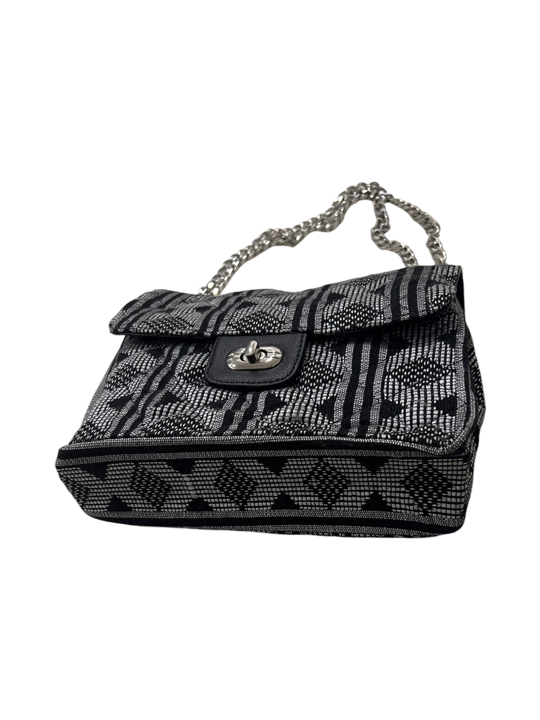 Luxury handbag, quilted purse with chain straps.