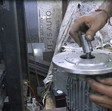 Person in working on Motor Fitting for Mounting machine