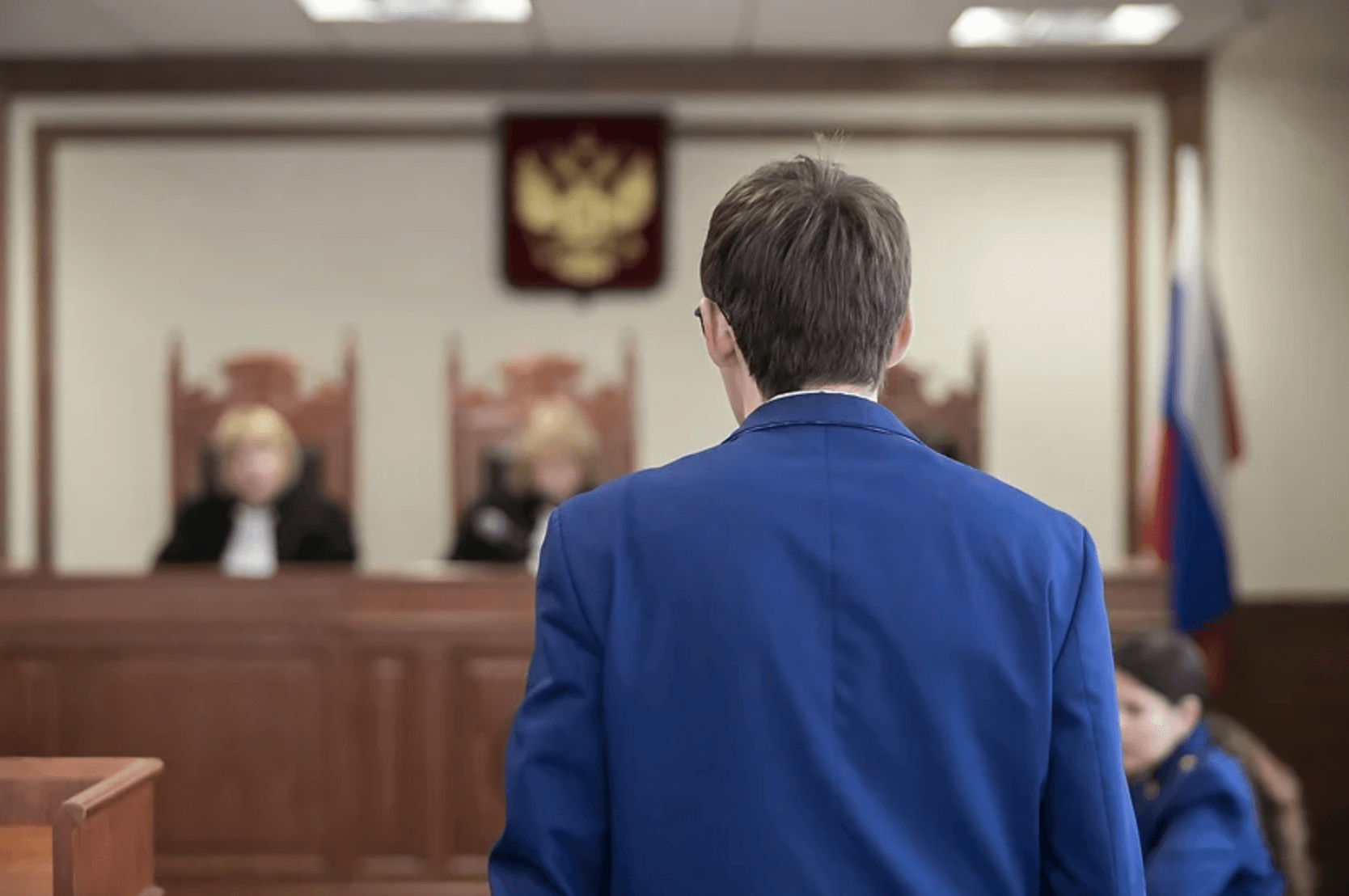 A confident criminal defense lawyer in a courtroom, representing a client.