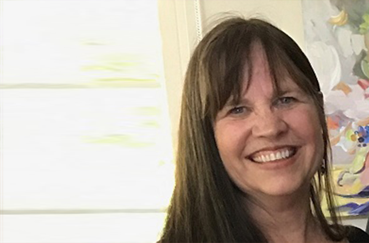 Krista Connolly speaking at a health event on homeopathy.