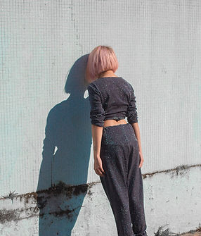 Girl Leaning on Wall