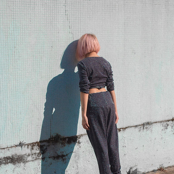 Girl Leaning on Wall