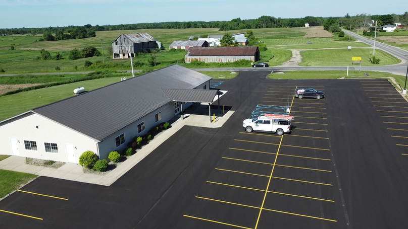 Exterior of Grant Township Hall with renovated brick facade, accessible entry ramp, and clear municipal signage
