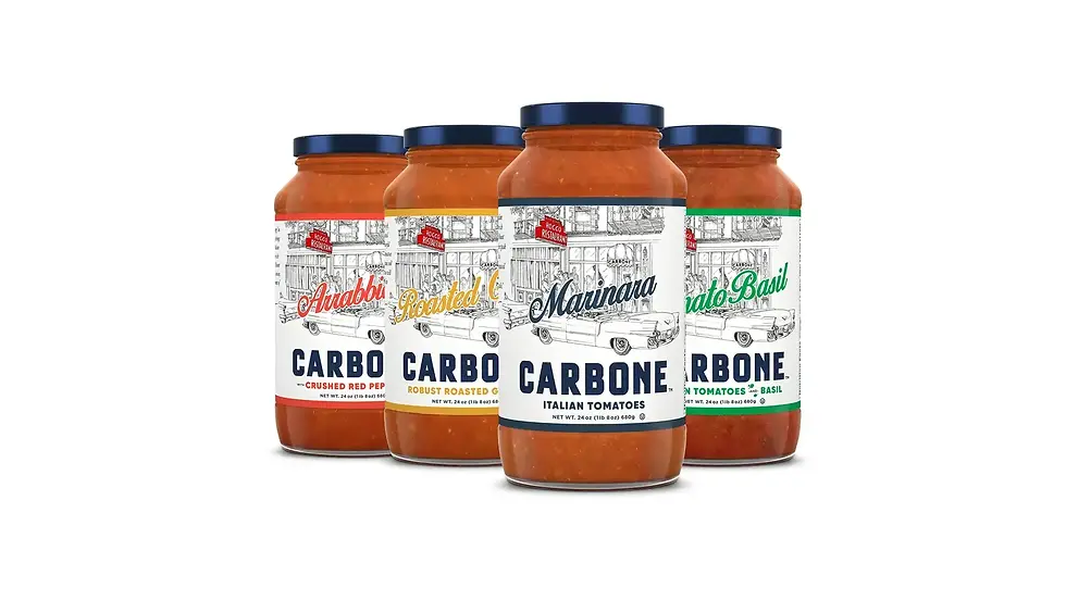 Four Carbone pasta sauce jars on a white background, labeled Arrabbiata, Roasted Garlic, Marinara, and Tomato Basil.